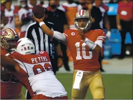  ?? NHAT V. MEYER — BAY AREA NEWS GROUP, FILE ?? San Francisco 49ers starting quarterbac­k Jimmy Garoppolo throws against the Arizona Cardinals at Levi’s Stadium in Santa Clara on Sept. 13.