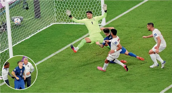  ?? GETTY IMAGES ?? US striker Christian Pulisic scores the winning goal in the crucial World Cup match but is about to collide heavily with Iran goalkeeper Alireza Beiranvand. Pulisic was later taken from the field, inset, to receive hospital treatment for a pelvic contusion.