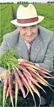  ??  ?? Tompsett and his prize-winning purple carrots: he was also the longest serving Pony Club district commission­er and founded an annual horse trials event