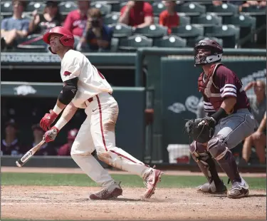 ?? Craven Whitlow/News-Times ?? It's gone: Razorback senior Luke Bonfield watches his three-run homer clear the left field fence against Texas A&M Sunday afternoon at Baum Stadium in Fayettevil­le. Bonfield went 2-4 with four RBIs to help the Hogs sweep the Aggies. The Hogs beat the...