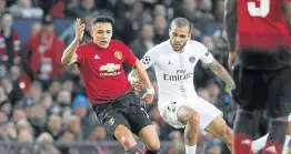  ?? Picture: GETTY IMAGES/JEAN CATUFFE ?? SHOWING INTENT: Manchester United’s Alexis Sanchez, left, battles for the ball with Dani Alves of PSG during the Uefa Champions League match at Old Trafford.