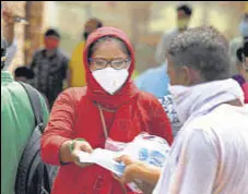  ?? HT PHOTO ?? Till August 1, more than 18,000 people had been fined for mask violations by officials of Gurugram MC, which has realised a fine amount of ₹90 lakh.