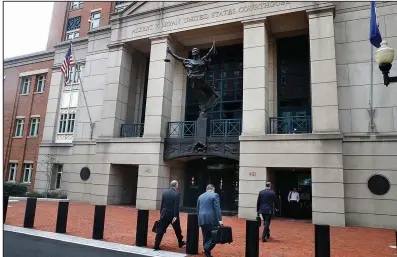  ?? AP/JACQUELYN MARTIN ?? Members of the defense team for Paul Manafort, including Thomas Zehnle (from left), Richard Westling and Kevin Downing, walk to federal court Monday as the trial of the former campaign chairman for President Donald Trump continues in Alexandria, Va.