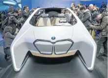 ?? Picture: BLOOMBERG ?? GRILLE APPEAL: Members of the media pore over the BMWi Inside Future concept vehicle, which was unveiled at the Consumer Electronic­s Show in Las Vegas
