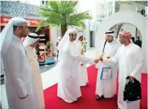  ??  ?? RED CARPET RECEPTION: Officials welcome pilgrims at Sharjah Internatio­nal Airport on Thursday.