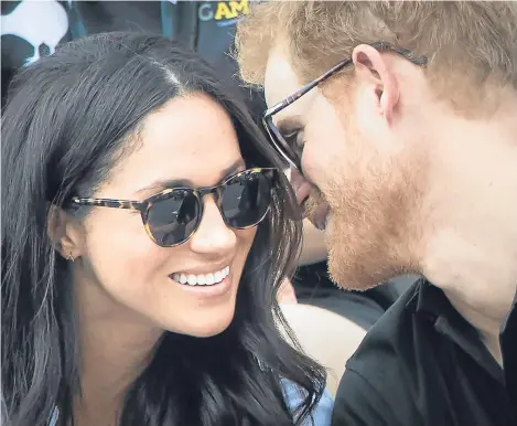  ??  ?? WITH a beaming smile and a discreet cordon of security, Prince Harry and his actress girlfriend Meghan Markle strode hand-in-hand for their first official public appearance together.
The long-awaited moment for royal fans, came as they joined a crowd...