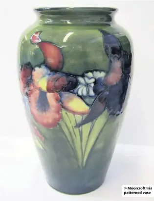  ??  ?? > Moorcroft Iris patterned vase