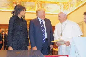  ?? EVAN VUCCI/ASSOCIATED PRESS ?? President Donald Trump and first lady Melania Trump exchange pleasantri­es with Pope Francis during their meeting at the Vatican on Wednesday.