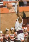  ?? STEVE JOHNSTON/ DAILY SOUTHTOWN ?? Brother Rice’s Khalil Ross finishes off a slam dunk against St. Laurence on Tuesday.