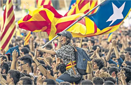  ??  ?? Students protest the Spanish government’s decision to ban the referendum, right; Carles Puigdemont, the Catalan president, below