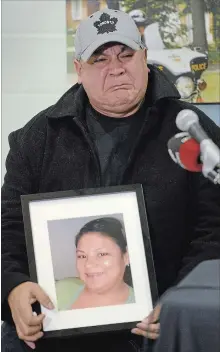  ?? CATHIE COWARD THE HAMILTON SPECTATOR ?? Trevor Miller, holding a photo of his murdered sister, Melissa Miller, breaks down during a press conference Thursday in Ohsweken. Miller, Alan Porter and Michael Jamieson were found dead in Middlesex County on Nov. 4.