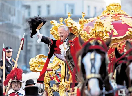  ??  ?? Alderman Peter Estlin waves from his gold coach yesterday after he became the 691st Lord Mayor of the City of London. A parade of 7,000 people, 200 horses and 150 floats took part in the Lord Mayor’s Show procession.