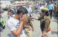  ?? HT ?? Police question youth outside a women’s college in Meerut.