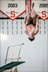  ?? JAMES BEAVER — FOR MEDIA NEWS GROUP ?? Pennridge junior Nick Marzuco looks for the pool as he flips during his dive in competitio­n against Souderton.