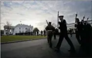  ?? MANUEL BALCE CENETA — THE ASSOCIATED PRESS ?? Honor guards from different branches of the U.S. Armed Forces, march on the North Lawn driveway of the White House in Washington, Sunday during rehearsal for the presidenti­al inaugurati­on on Friday.