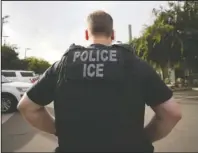  ?? The Associated Press ?? ICE: A U.S. Immigratio­n and Customs Enforcemen­t (ICE) officer looks on during an operation on July 8, 2019, in Escondido, Calif. Internatio­nal students will be forced to leave the U.S. or transfer to another college if their schools offer classes entirely online this fall, under new guidelines issued Monday by federal immigratio­n authoritie­s.