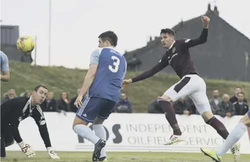  ??  ?? 0 Hearts striker Kyle Lafferty fires home to make it 1-1 but the visitors succumbed to a late penalty winner by Rory Mcallister.