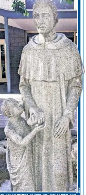  ??  ?? IT’S JUST A HARD ROLL: Blackfriar­s Priory School in Adelaide, Austra-alia, has vowed to “substantia­lly” alter this statue of Saint Martin de Porres.