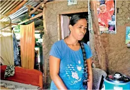  ??  ?? Priyangani and her family live in a mud house on her grandfathe­r's land, for which they have no deeds. There’s no electricit­y or running water