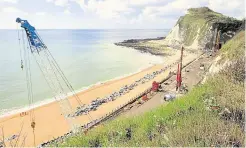  ?? Picture: Rob Riddle ?? Work to rebuild the sea wall for the Dover to Folkestone railway line