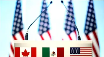  ??  ?? The flags of Canada, Mexico and the US are seen on a lectern before a joint news conference on the closing of the seventh round of NAFTA talks in Mexico City, Mexico. The US has dropped a contentiou­s demand from the renegotiat­ion of the NAFTA to impose restrictio­ns on Mexican agricultur­al exports, Mexico’s top farm lobby said on Sunday. — Reuters photo