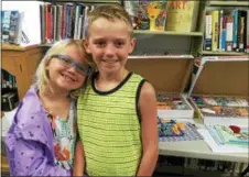  ??  ?? Carsyn, left, and Caelan Efaw of Amsterdam are among the many area children who take part in Galway Public Library programs.