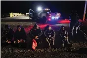  ?? GREGORY BULL — THE ASSOCIATED PRESS FILE ?? Migrants wait to be processed after crossing the U.S. border near Yuma, Ariz., on Jan. 6.