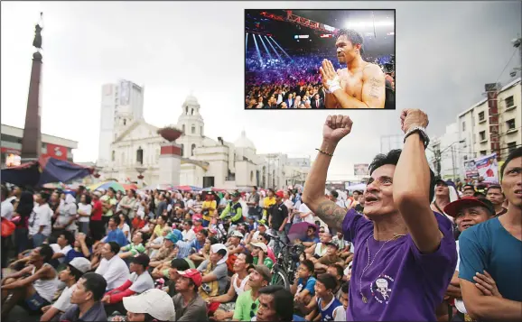  ??  ?? A Filipino reacts to the live satellite feed of the welterweig­ht title fight between Filipino boxing hero Manny Pacquiao and Floyd Mayweather Jr during a free public viewing in downtown Manila, Philippine­s
on May 3. (Inset): Pacquiao in the ring after...