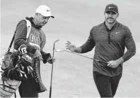  ?? Matt Dunham / Associated Press ?? Brooks Koepka says he didn’t “have to think much” thanks to the advice of caddie Ricky Elliott, who is a member of Royal Portrush.