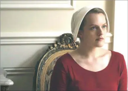  ?? HULU ?? Elisabeth Moss plays Offred in “The Handmaid’s Tale,”which grows even darker in Season 2.