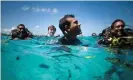  ?? Photo ?? Mohamed Nasheed and other cabinet members attend an underwater cabinet meeting in the Maldives in 2009.