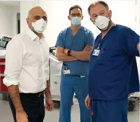  ?? ?? OUTLIER: Sajid Javid and Dr James, centre, at King’s College Hospital