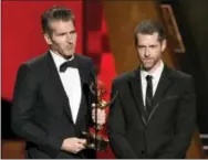  ?? PHOTO BY CHRIS PIZZELLO — INVISION — AP, FILE ?? In this file photo, creator-showrunner­s David Benioff, left, and D.B. Weiss accept the award for outstandin­g writing for a drama series for “Game Of Thrones” at the 67th Primetime Emmy Awards in Los Angeles. HBO’s announceme­nt, Wednesday that Benioff...