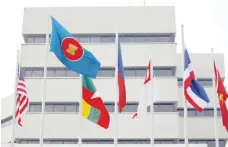  ?? — Reuters ?? Flags are seen outside the Asean secretaria­t building in Jakarta.