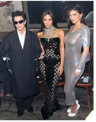  ?? ?? KIM Kardashian and Kris and Kylie Jenner in style at Paris Fashion Week 2024.