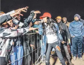  ??  ?? TOUGH GIRL. Rapper Fifi Cooper entertains her fans with song.