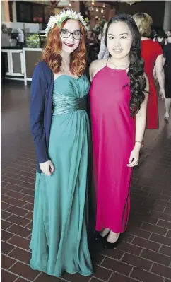  ??  ?? Jenna McConnell, left, and Angelina Salvador of Holy Trinity Catholic High School prepare to watch the awards.