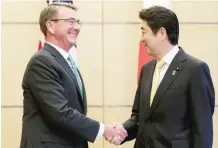  ?? — AFP ?? US Defence Secretary Ash Carter with Japan’s Prime Minister Shinzo Abe at the latter’s official residence in Tokyo on Tuesday.