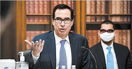  ?? AL DRAGO/GETTY ?? Treasury Secretary Steven Mnuchin has limited the release of data on what businesses received pandemic loans, calling the informatio­n “proprietar­y.”