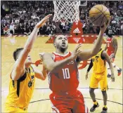  ?? Eric Christian Smith ?? The Associated Press Rockets guard Eric Gordon soars to the basket past Jazz forward Jonas Jerebko in the second half of Houston’s 120-99 win Monday at the Toyota Center.