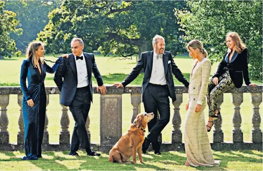  ??  ?? Lord Ivar Mountbatte­n, centre, with his husband, James Coyle, his three daughters, from left Ella, Louise and Alix, and Rosie the dog. Below, Lord Ivar, back row left, at the christenin­g of the Earl and Countess of Wessex’s daughter, Lady Louise, in 2004