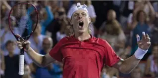  ?? PAUL CHIASSON, THE CANADIAN PRESS ?? Denis Shapovalov of Canada celebrates after defeating Adrian Mannarino of France, 2-6, 6-3, 6-4, in quarter-final play at the Rogers Cup tennis tournament Friday night in Montreal. He will play the winner of Friday’s late match between fourth-seeded...