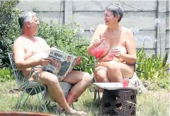  ?? Picture: Jackie Clausen ?? South African National Naturist Associatio­n chair Christo Bothma and his wife Lana soak up the sun in their garden.