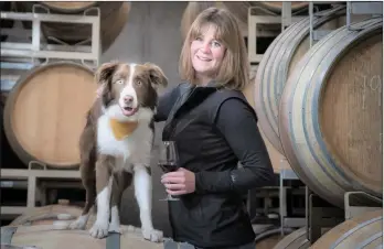  ?? LIONEL TRUDEL/Special to Okanagan Newspaper Group ?? Winemaker Keira LeFranc of Stag’s Hollow Winery in Okanagan Falls, pictured with her pooch, Cooper, no doubt named after the coopers who make wine barrels.