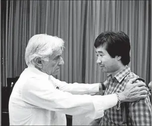 ?? CONTRIBUTE­D ?? Leonard Bernstein and Toshiyuki Shimada at the Los Angeles Philharmon­ic Institute in 1983