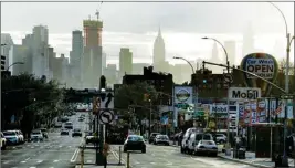  ?? PTI ?? Vehicles travel Northern Boulevard on Saturday, in the Jackson Heights section of the Queens borough of New York