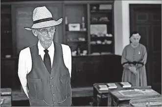  ??  ?? Bob and Jean Kreisel, both 84, greet visitors in the schoolhous­e at Ohio Village. The Kreisels explained what school was like for teachers and students in the 1890s.