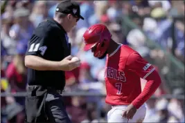  ?? MATT YORK — THE ASSOCIATED PRESS ?? The Angels’ Jo Adell crosses the plate after scoring on a throwing error while stealing third base during the third inning of a spring training game against the Texas Rangers.