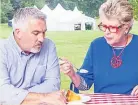  ??  ?? TENSE Judges tuck into the traybake