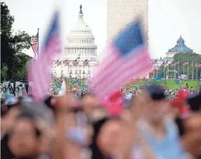  ?? ANDREW HARNIK/AP FILE ?? Just 12% of Asian American adults believe U.S. democracy is working extremely or very well, though another 47% say it functions “somewhat” well.